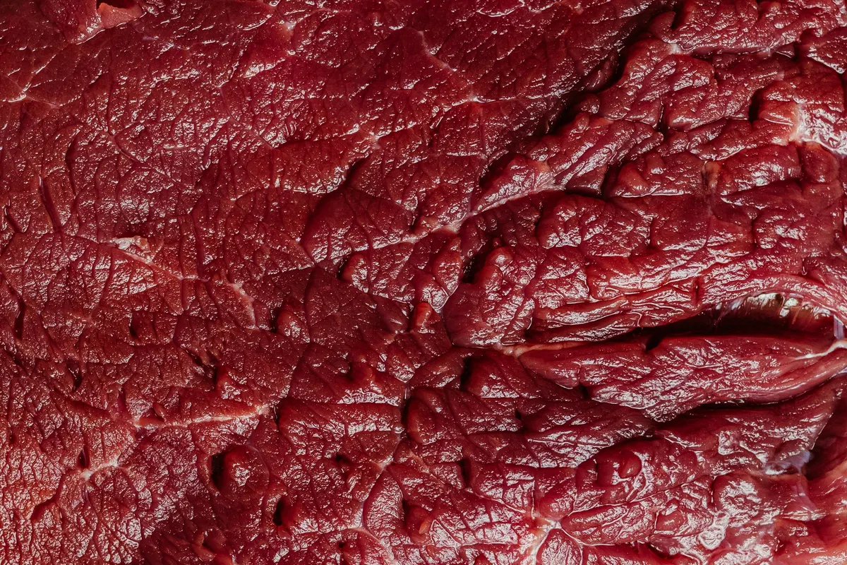 Close-up of raw beef showing marbled texture before freeze-drying